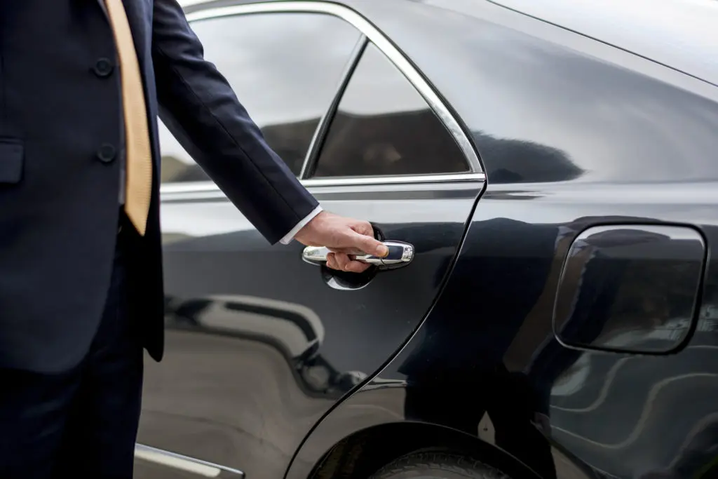 Businessman Handle Limousine Door Car